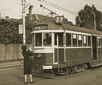 M&MTB conductress pulling down the trolley pole, 1942. Photograph State Library Victoria